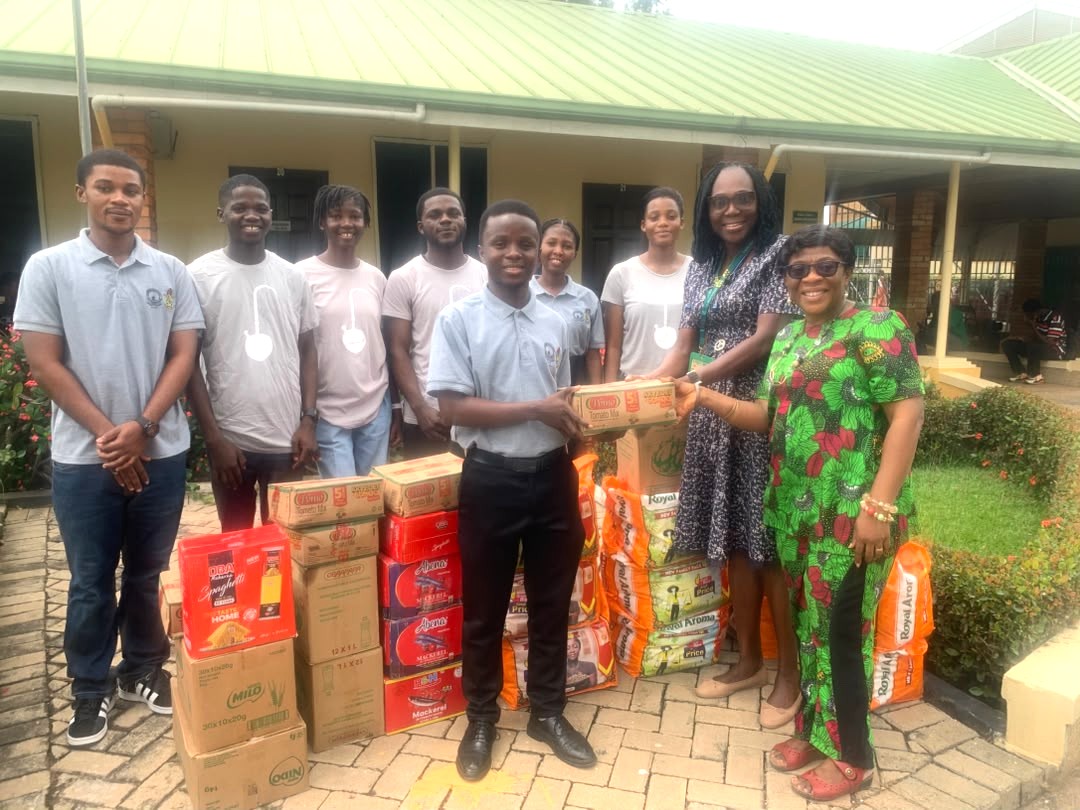 Mrs. Theodora Oduro & Mrs. Berince Peasah receiving food items from Edu Fondazoine Scholars Association
